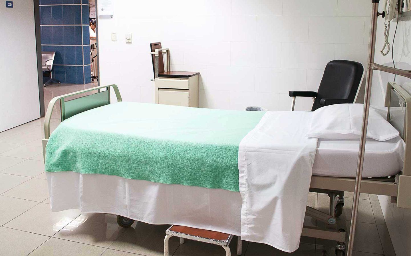 medical bed in hospital with green sheet