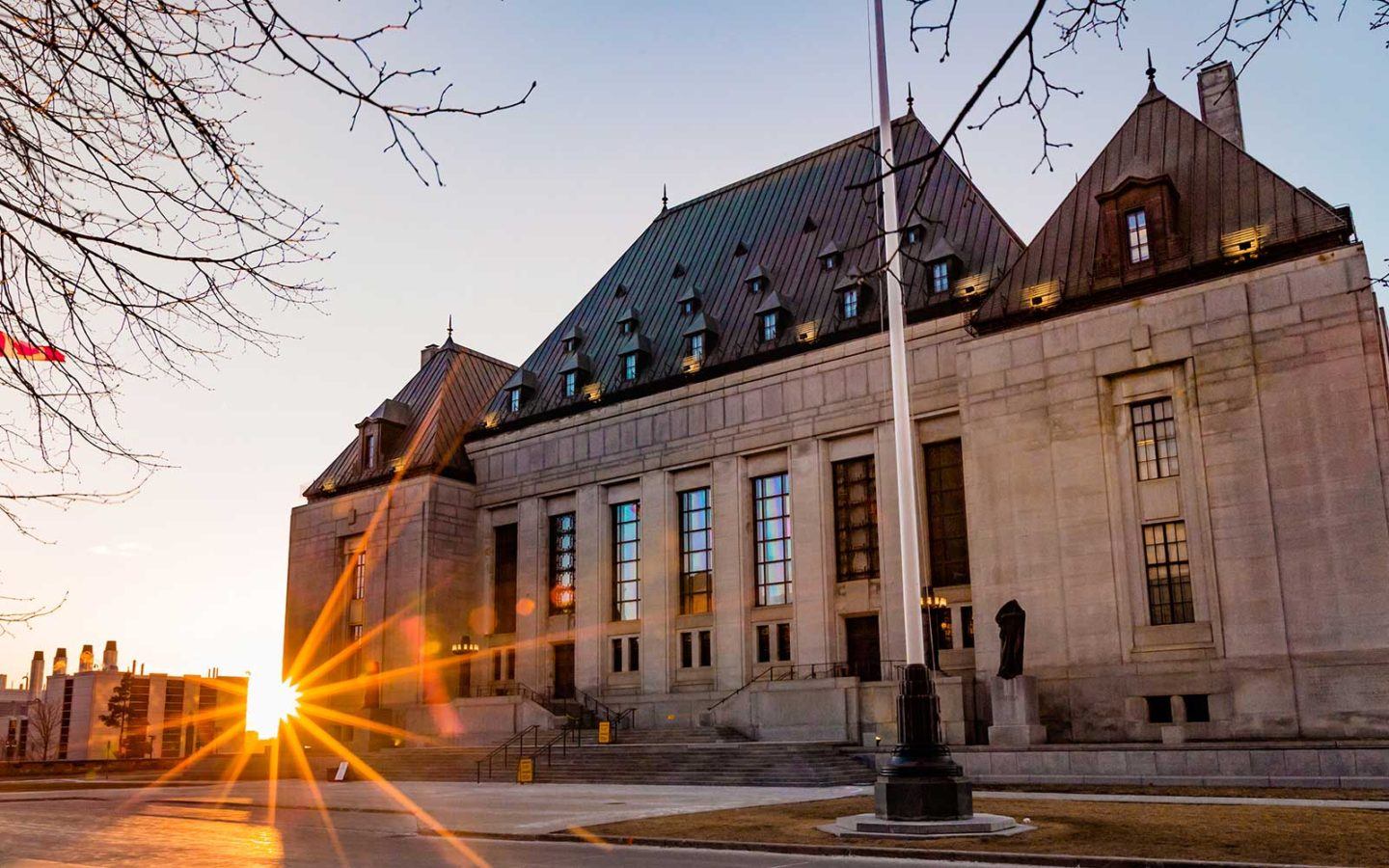 exterior of supreme court building in ottawa ontario at sunset