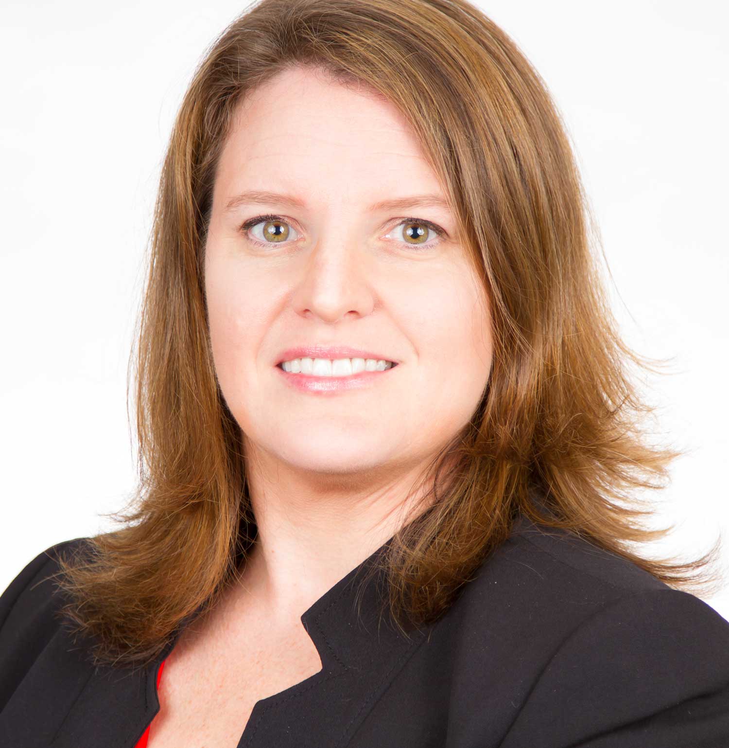 smiling woman with brown hair wearing black suit